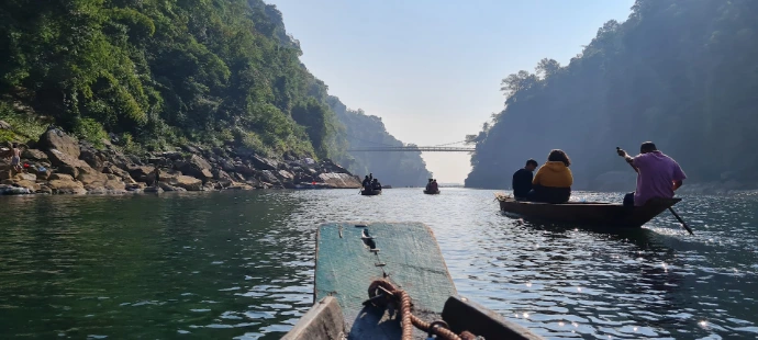a group of people riding on the back of a boat